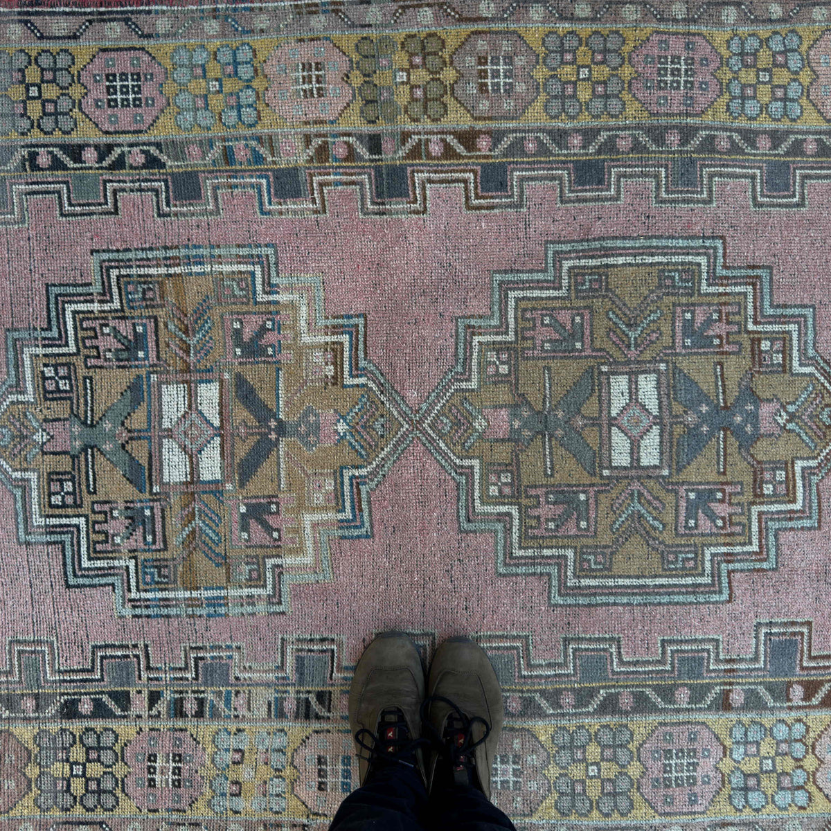 1970s pink vintage Turkish geometric rug with traditional design, hand-knotted weave and low pile.