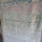1970s pale blue vintage Turkish geometric rug with neutral design, hand-knotted weave and low pile.