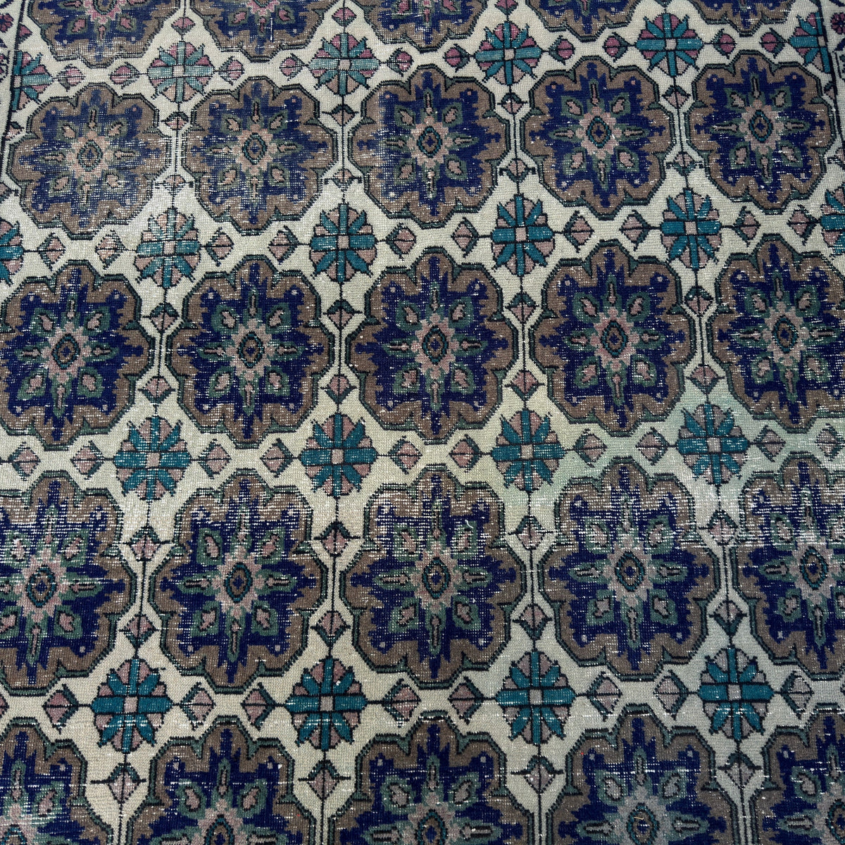 1970s blue vintage Turkish geometric rug with geometric design, hand-knotted weave and low pile.