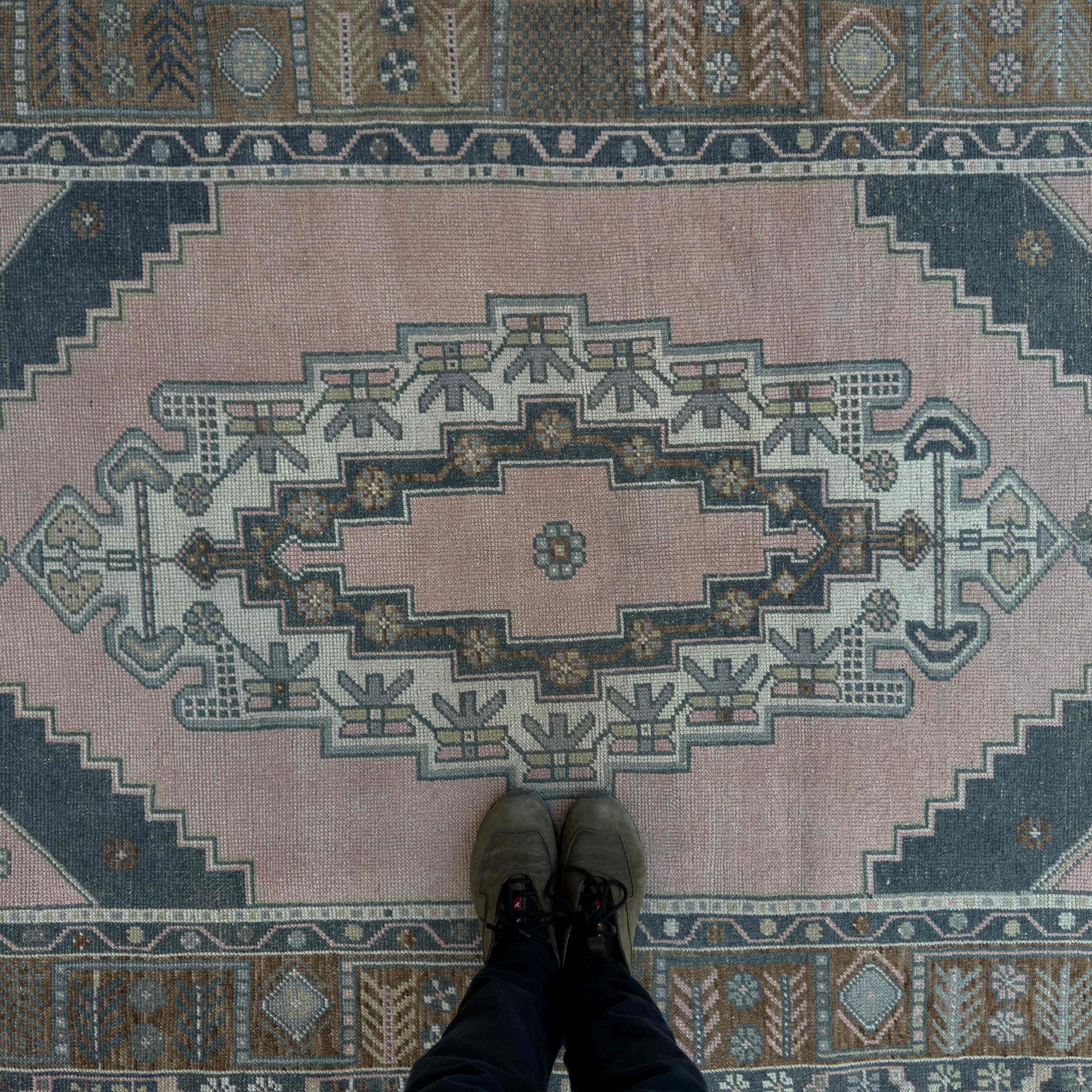 1970s pink vintage Turkish geometric rug with traditional design, hand-knotted weave and low pile.