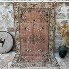 Pink 5' x 9' vintage geometric rug with geometric design, handmade in Turkey – Flint.