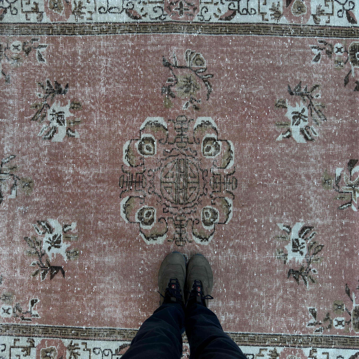 1970s pink vintage Turkish geometric rug with geometric design, hand-knotted weave and low pile.