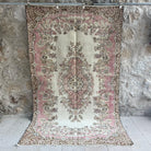 Pink 5' x 9' vintage geometric rug with medallion design, handmade in Turkey – Forster.