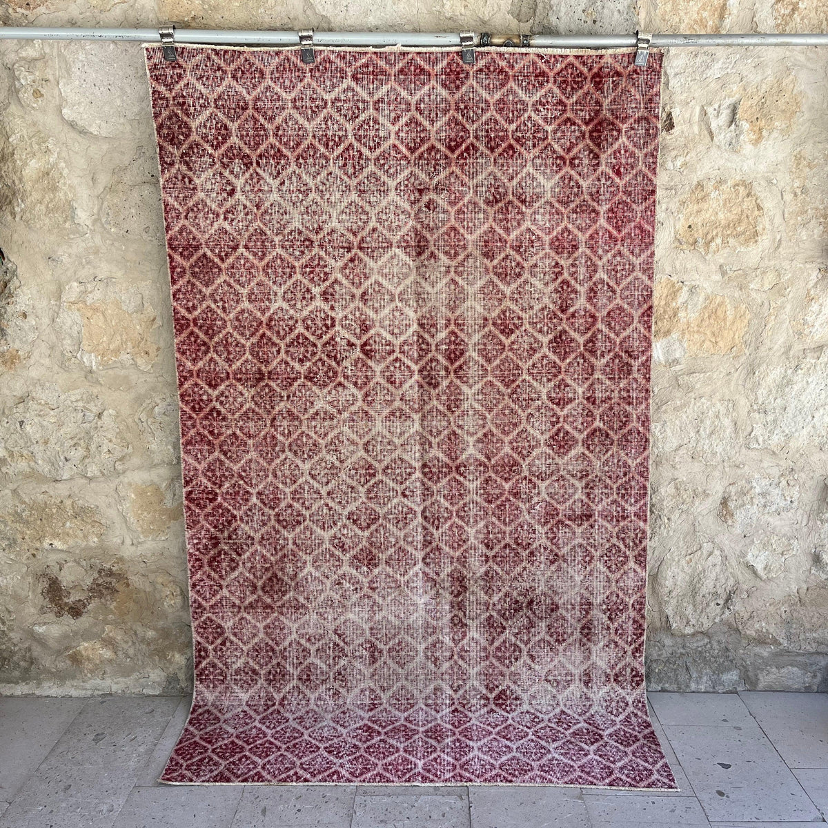 Red 5' x 9' vintage geometric rug with floral design, handmade in Turkey – Eryn.