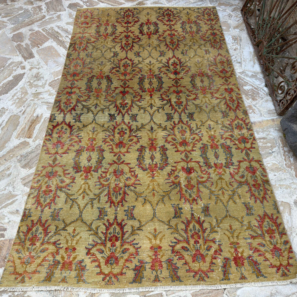 Yellow 5' x 9' vintage Turkish geometric rug in wool and cotton, shown on the floor.