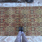 1970s yellow vintage Turkish geometric rug with floral design, hand-knotted weave and low pile.