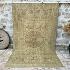 Brown 6' x 10' vintage geometric rug with medallion design, handmade in Turkey – Ethan.
