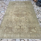 Brown 6' x 10' vintage Turkish geometric rug in wool and cotton, shown on the floor.