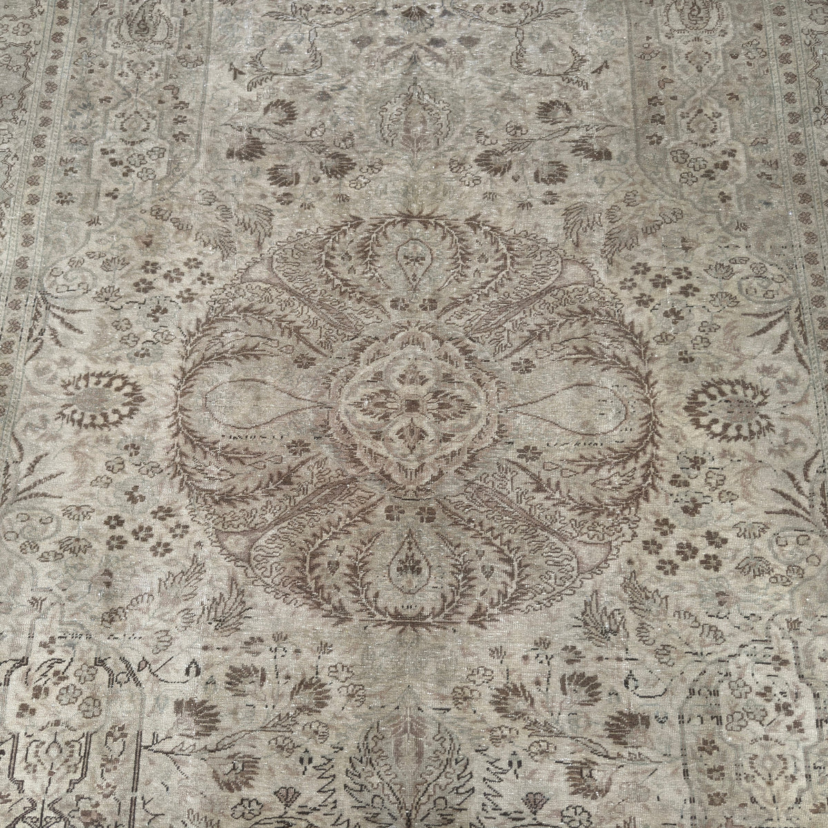 1970s brown vintage Turkish geometric rug with medallion design, hand-knotted weave and low pile.