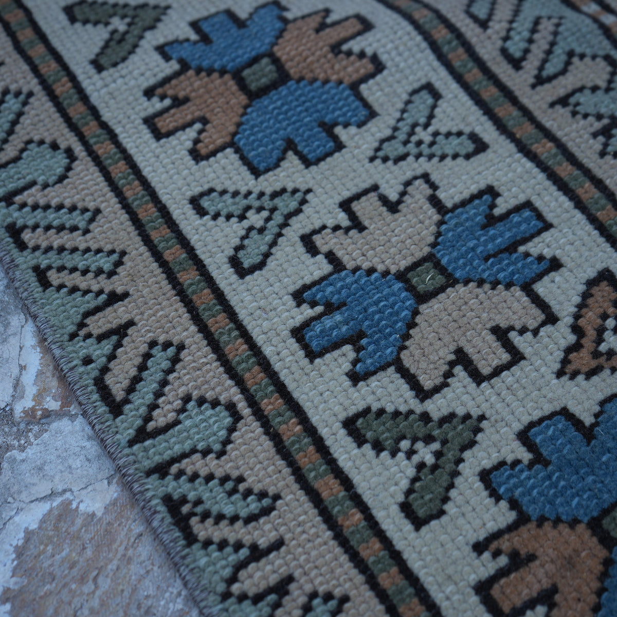 Beige 6' x 7' vintage Turkish geometric rug in wool, shown on the floor.