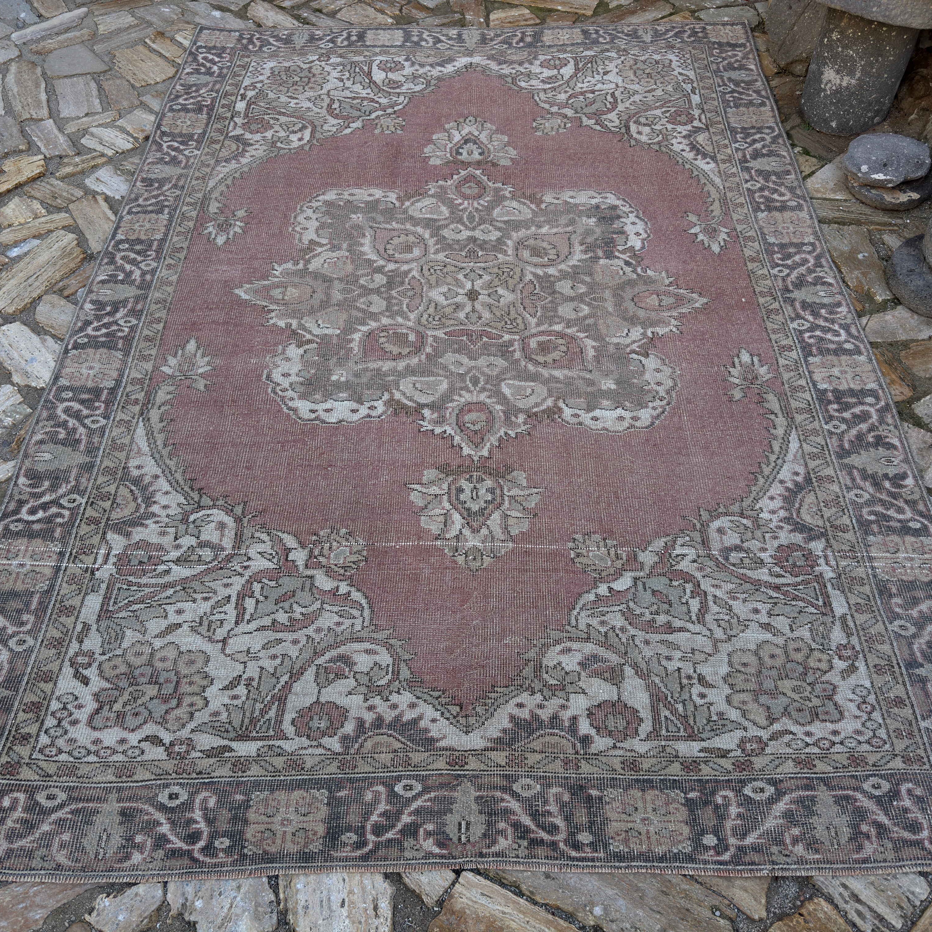 Pale Red 6' x 9' vintage Turkish geometric rug in wool and cotton, shown on the floor.
