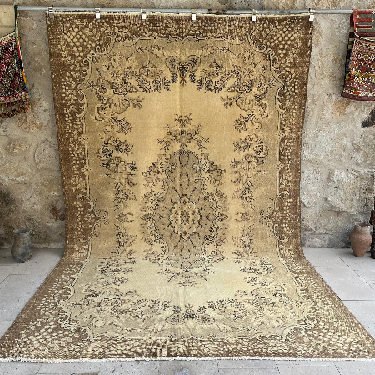 Brown 7' x 11' vintage geometric rug with medallion design, handmade in Turkey – Carleton.