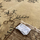1970s brown vintage Turkish geometric rug with medallion design, hand-knotted weave and low pile.