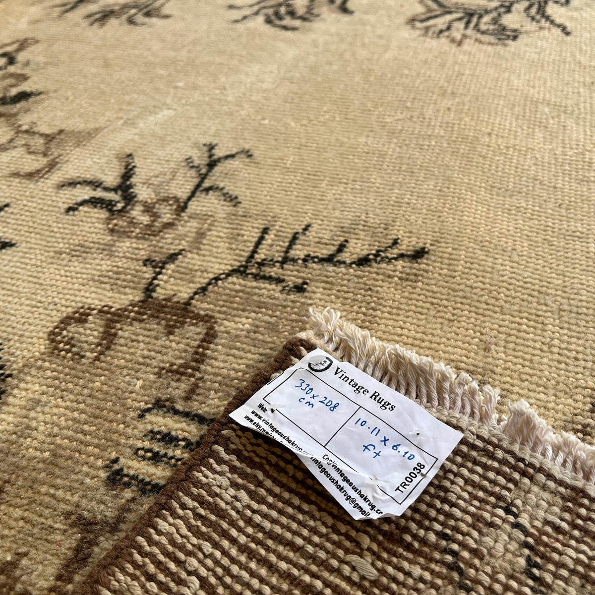1970s brown vintage Turkish geometric rug with medallion design, hand-knotted weave and low pile.