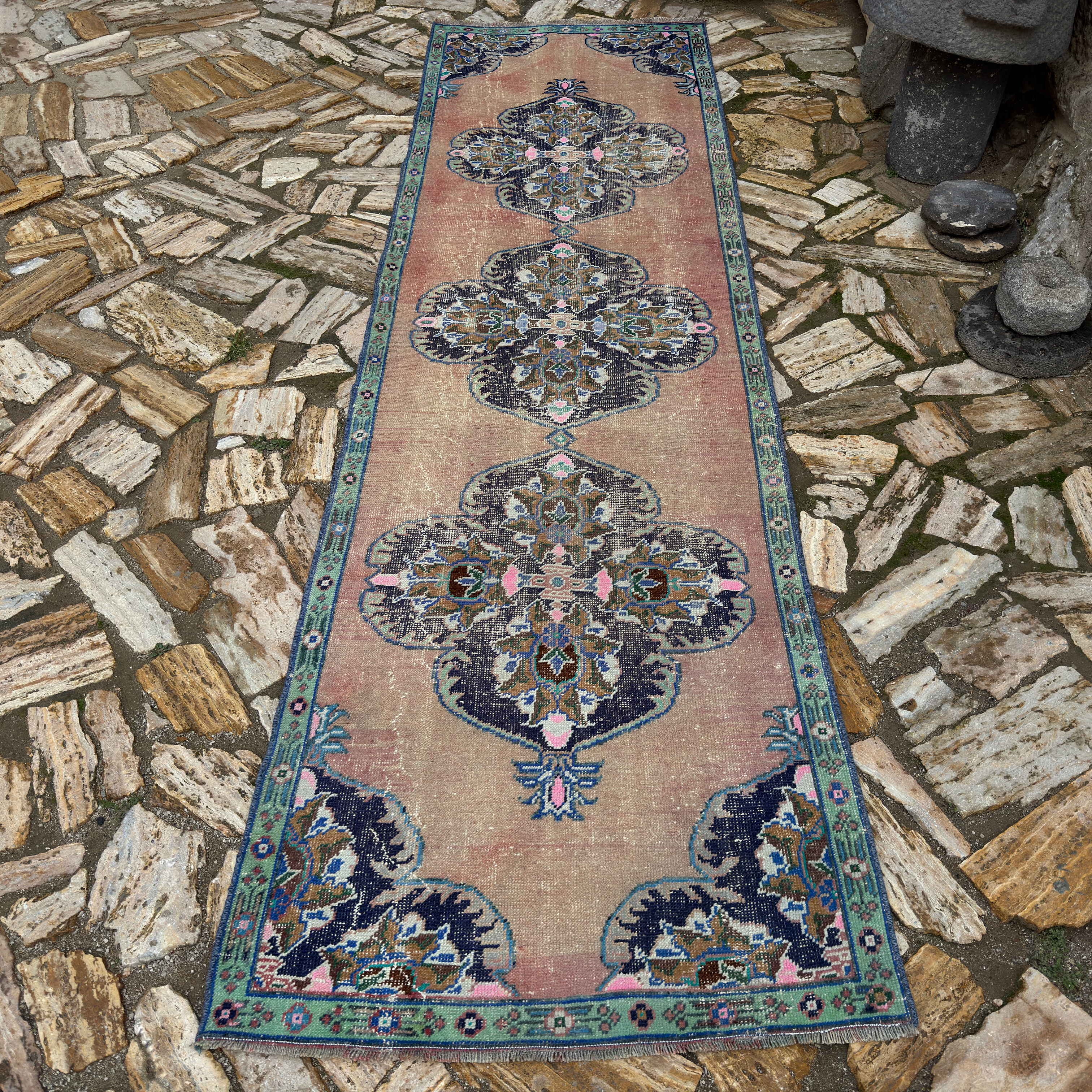 Pale Red 3' x 11' vintage Turkish geometric runner rug in wool and cotton, shown on the floor.