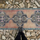 1970s pale red vintage Turkish geometric runner rug with traditional design, hand-knotted weave and low pile.
