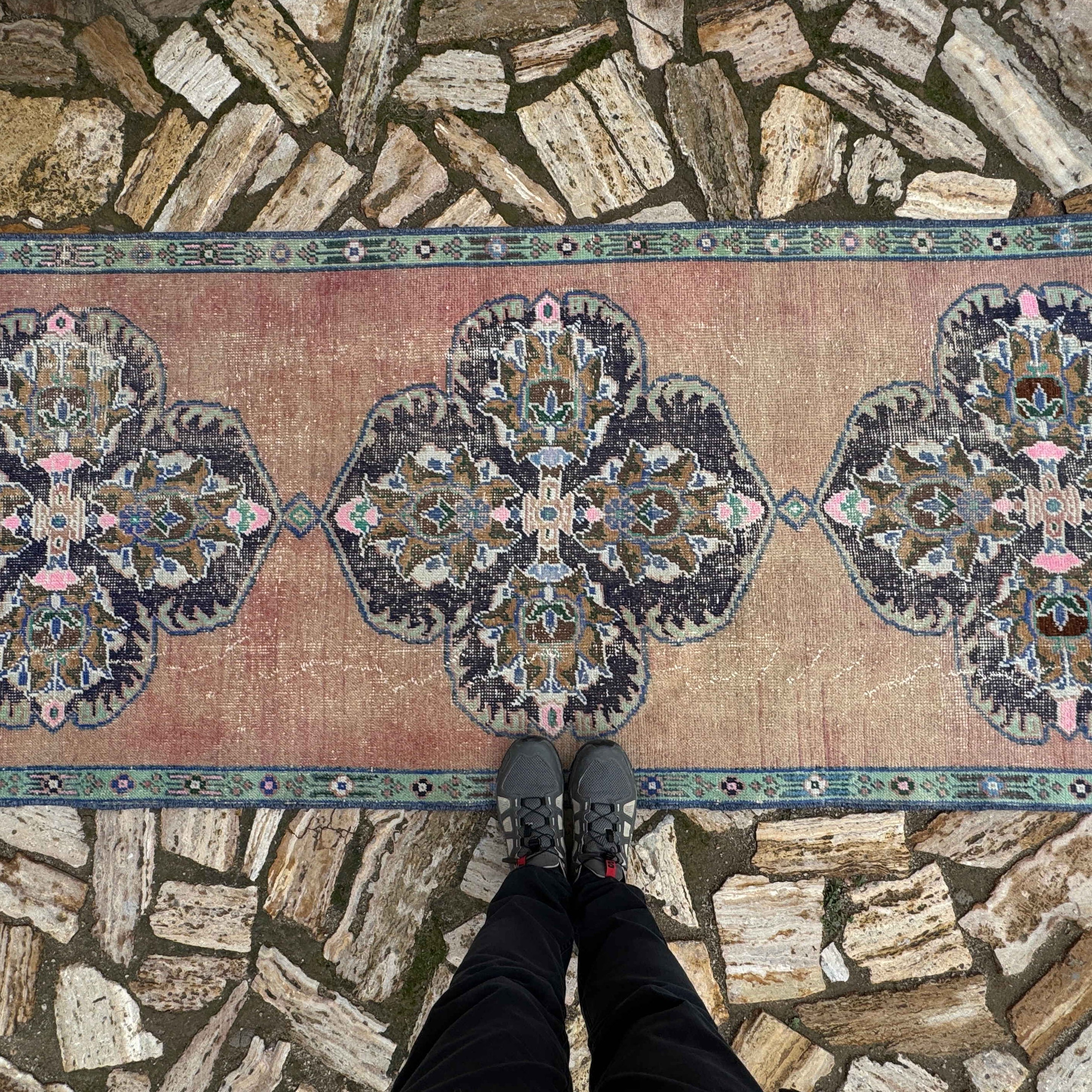 1970s pale red vintage Turkish geometric runner rug with traditional design, hand-knotted weave and low pile.