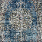 1970s blue vintage Turkish kayseri rug with traditional design, hand-knotted weave and low pile.