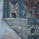 1970s blue vintage Turkish kayseri rug with floral design, hand-knotted weave and low pile.