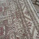 Close-up of the pale beige vintage Turkish kayseri rug showing neutral details, hand-knotted weave, wool and cotton and low pile.