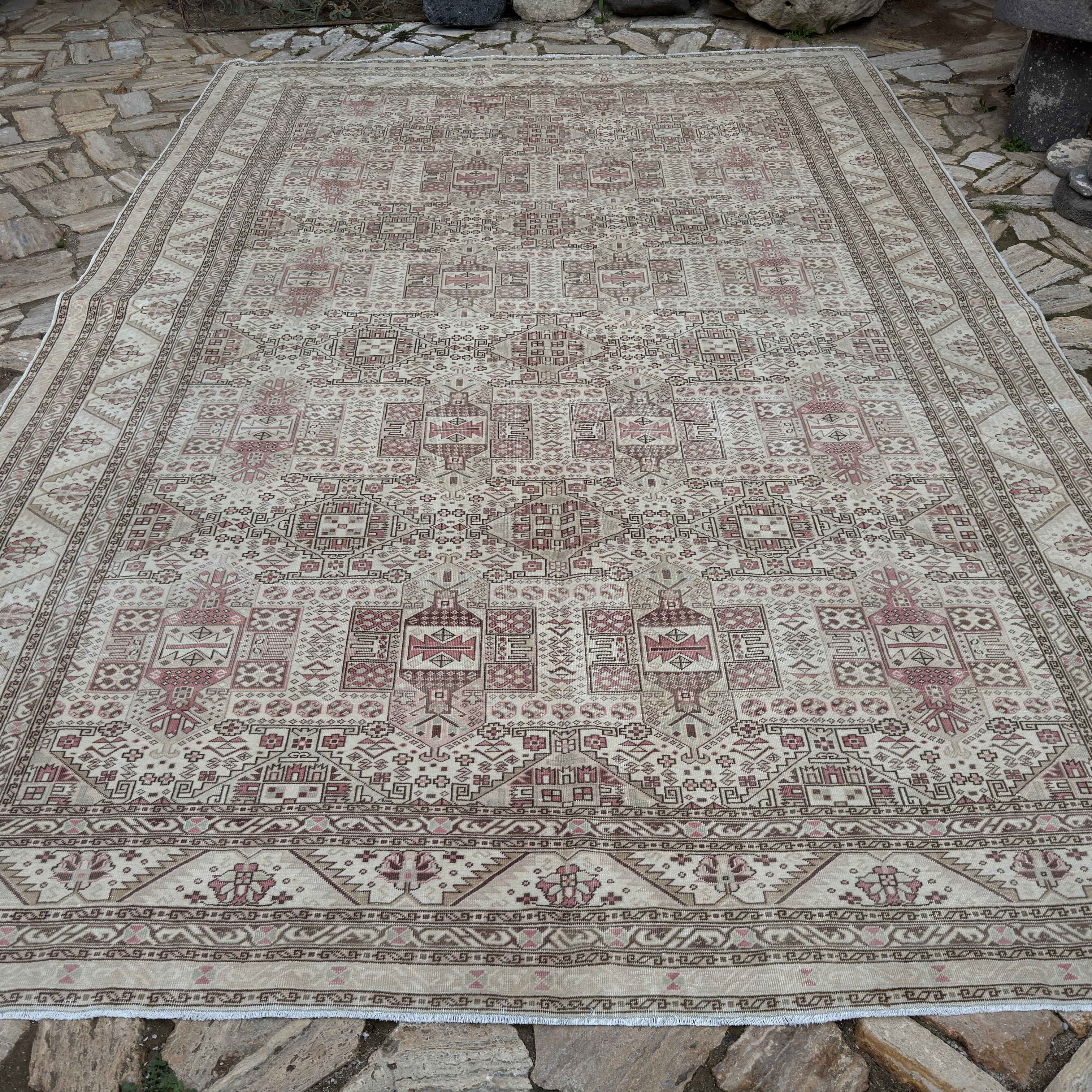 Pale Beige 9' x 13' vintage Turkish kayseri rug in wool and cotton, shown on the floor.