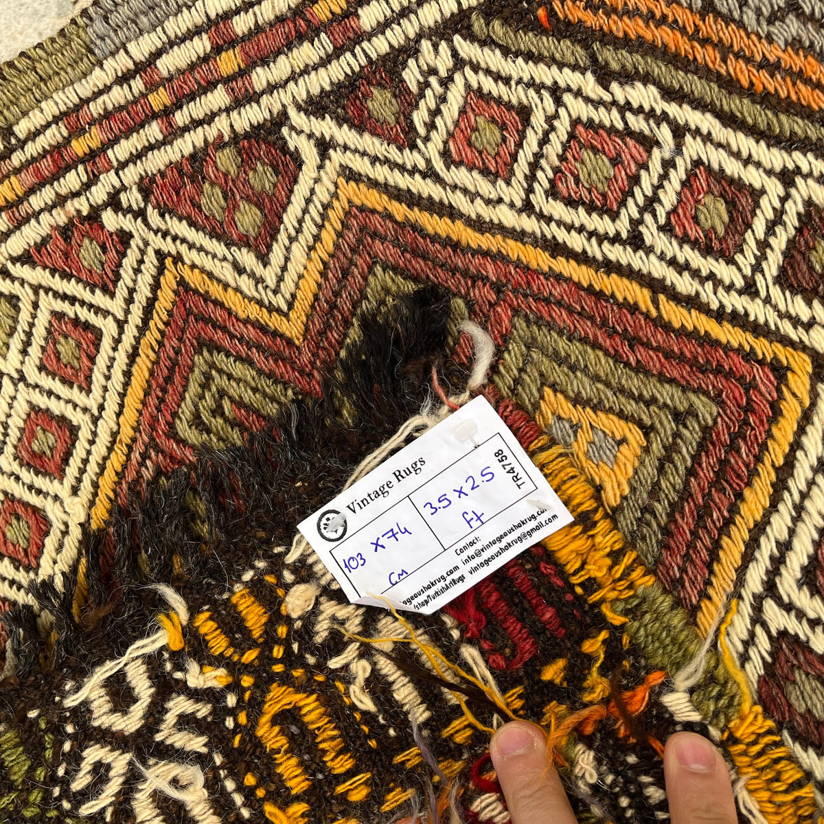 Close-up of the beige vintage Turkish kilim rug showing traditional details, flatweave construction, wool and cotton and low pile.