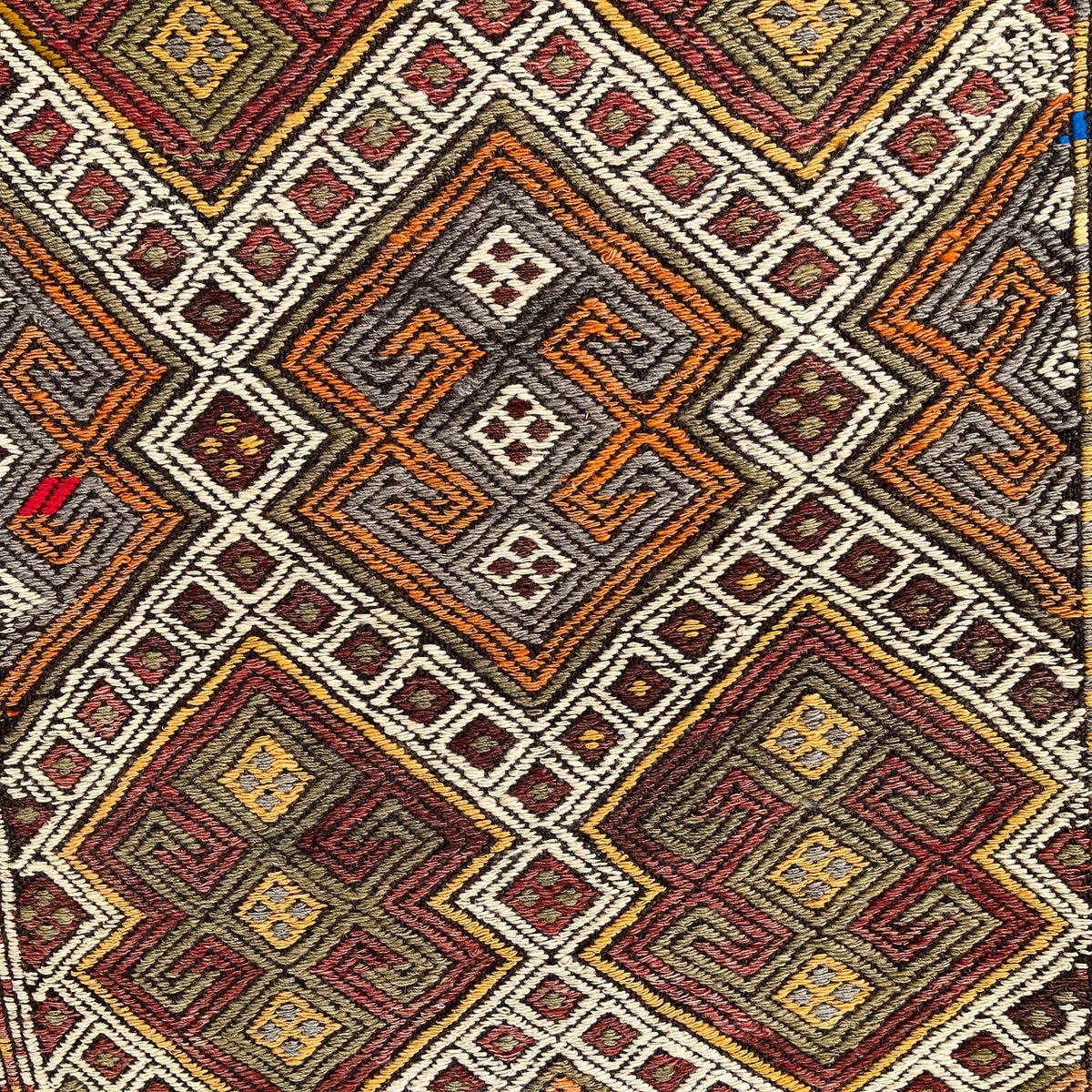 Beige 2' x 3' vintage Turkish kilim rug in wool and cotton, shown on the floor.