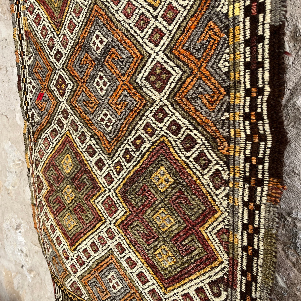1970s beige vintage Turkish kilim rug with traditional design, flatweave construction and low pile.