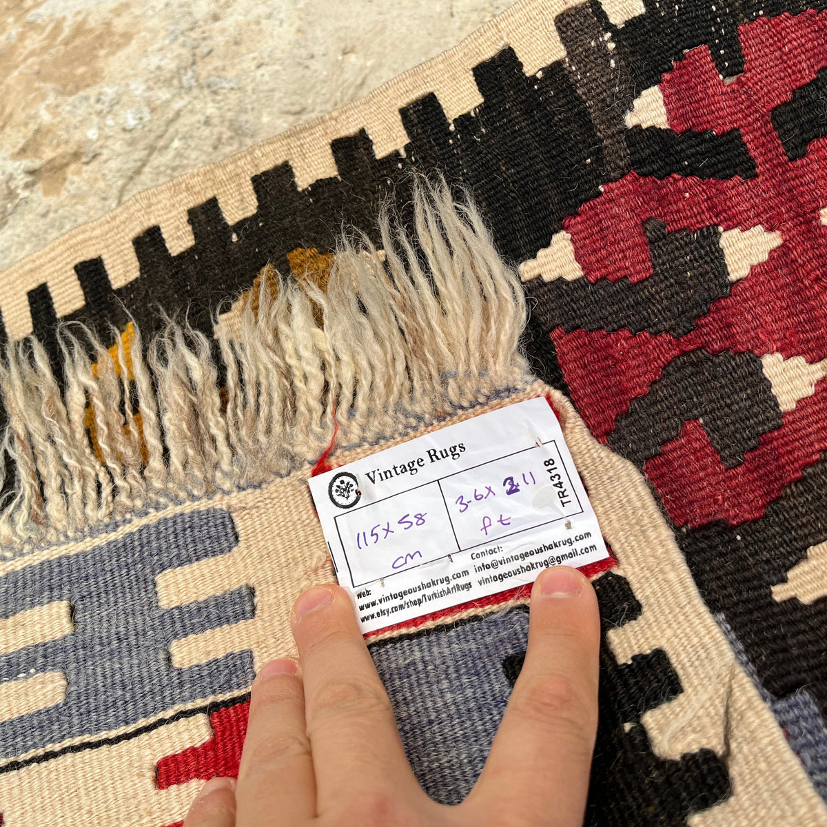 Close-up of the blue vintage Turkish kilim rug showing traditional details, flatweave construction, wool and cotton and low pile.