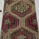 1970s pink vintage Turkish kilim rug with traditional design, hand-knotted weave and low pile.
