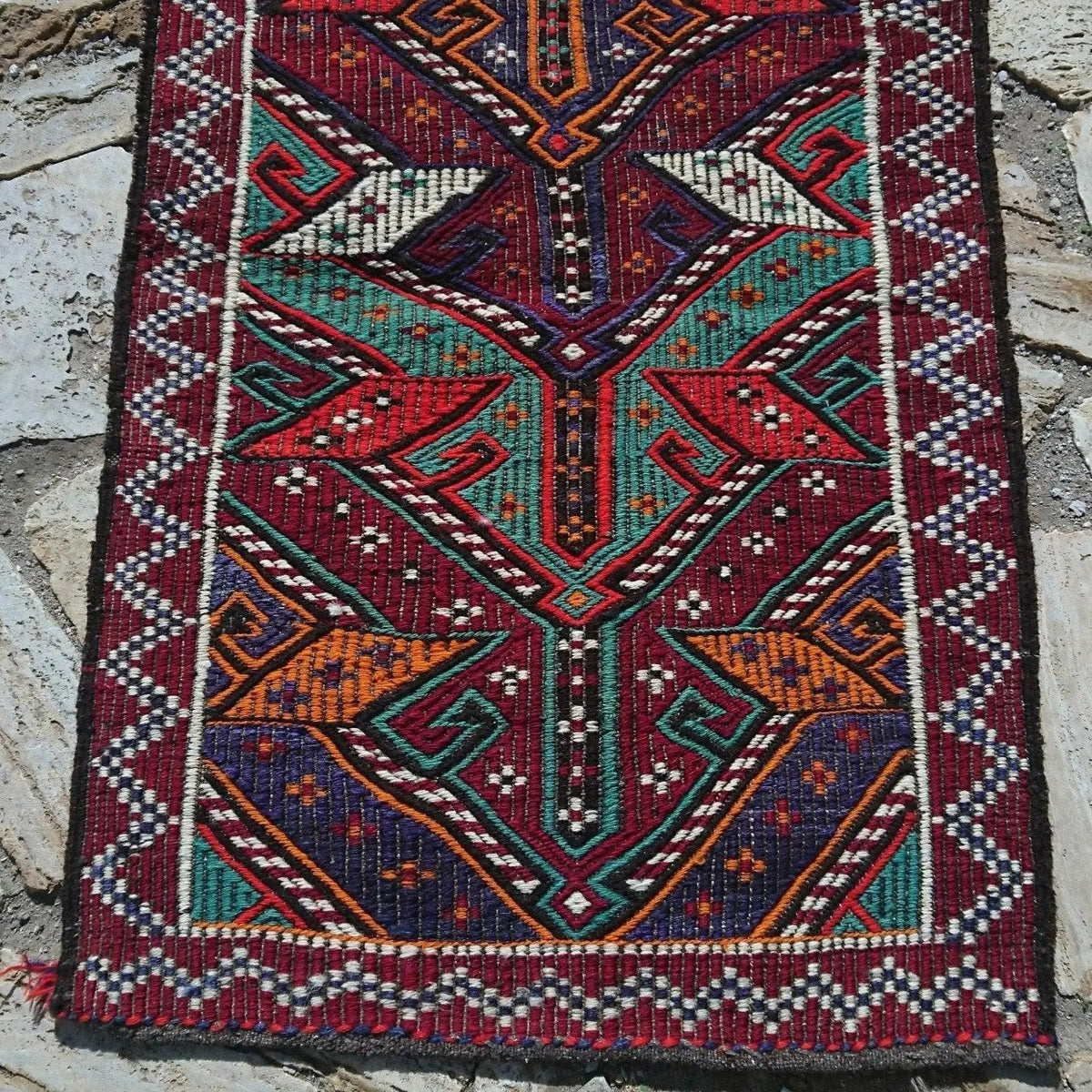 Red 2' x 3' vintage Turkish kilim rug in wool and cotton, shown on the floor.