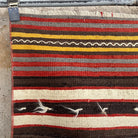 Red 2' x 4' vintage Turkish kilim rug in wool and cotton, shown on the floor.