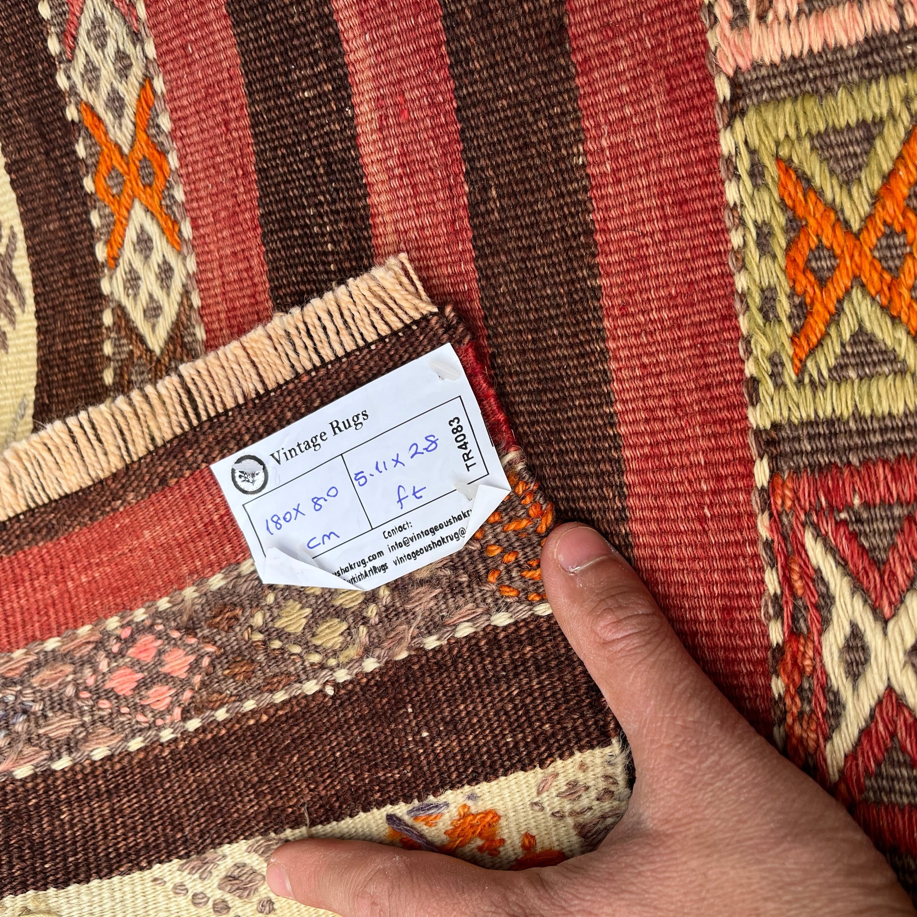 1970s red vintage Turkish kilim rug with traditional design, flatweave construction and low pile.