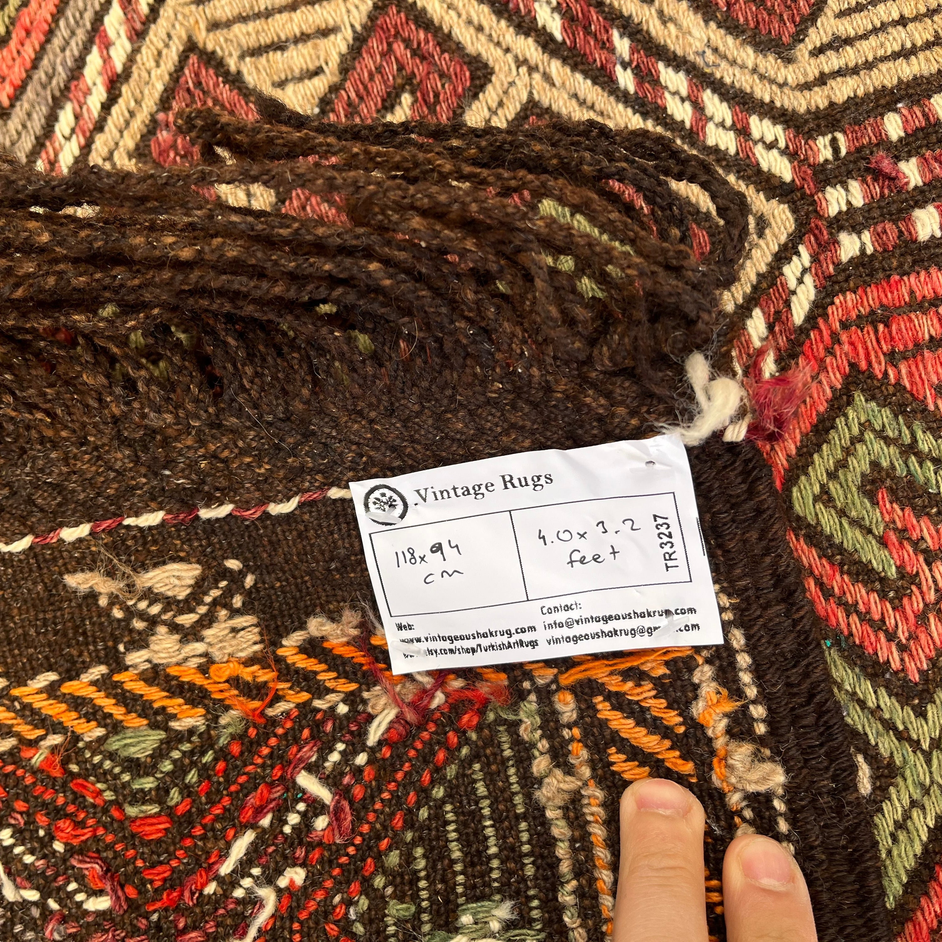 1970s brown vintage Turkish kilim rug with traditional design, flatweave construction and low pile.