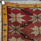 1970s red vintage Turkish kilim rug with traditional design, flatweave construction and low pile.