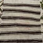 1970s black vintage Turkish kilim rug with striped design, flatweave construction and low pile.