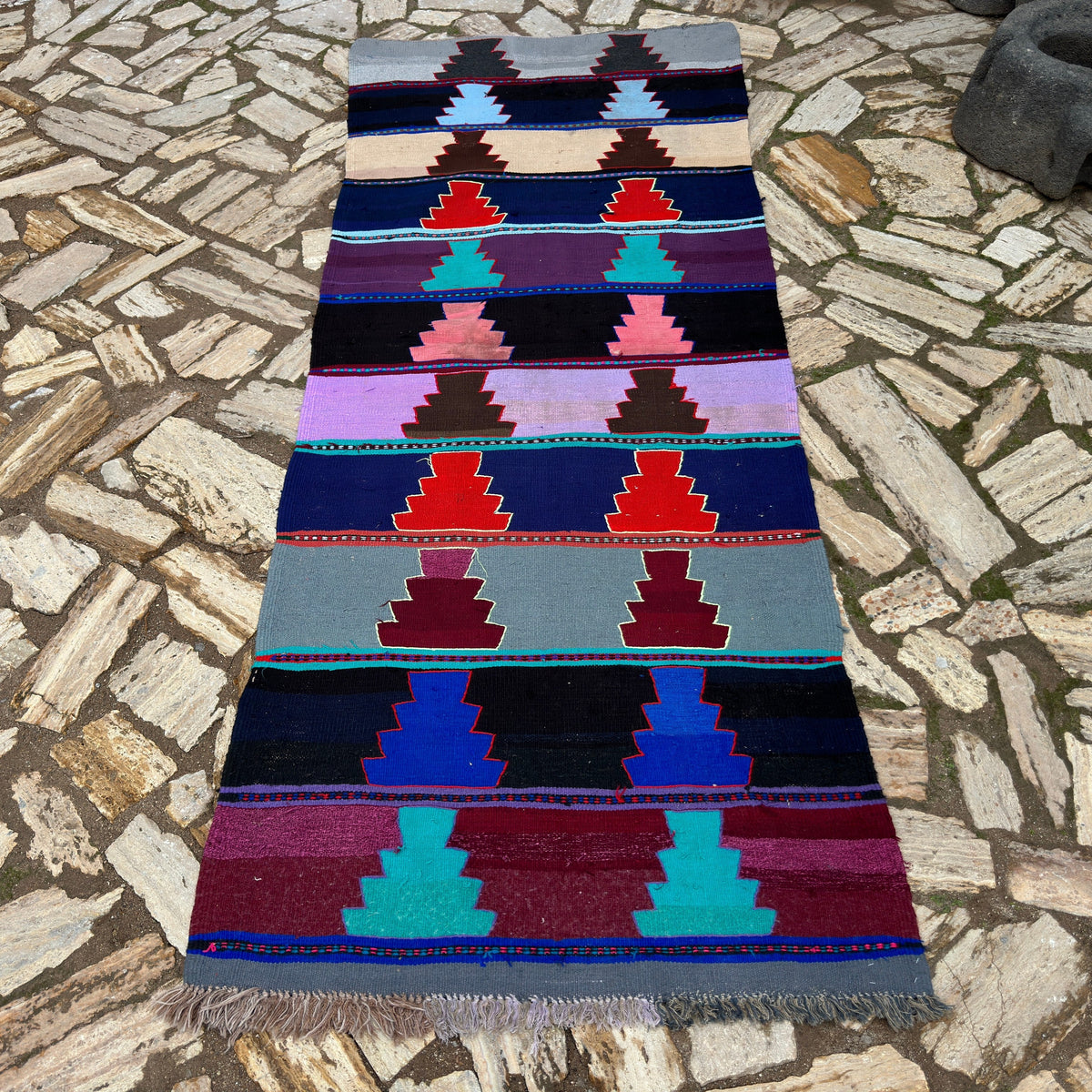 Blue 3' x 9' vintage Turkish kilim rug in wool and cotton, shown on the floor.