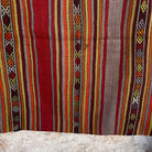 Red 4' x 4' vintage Turkish kilim rug in wool and cotton, shown on the floor.
