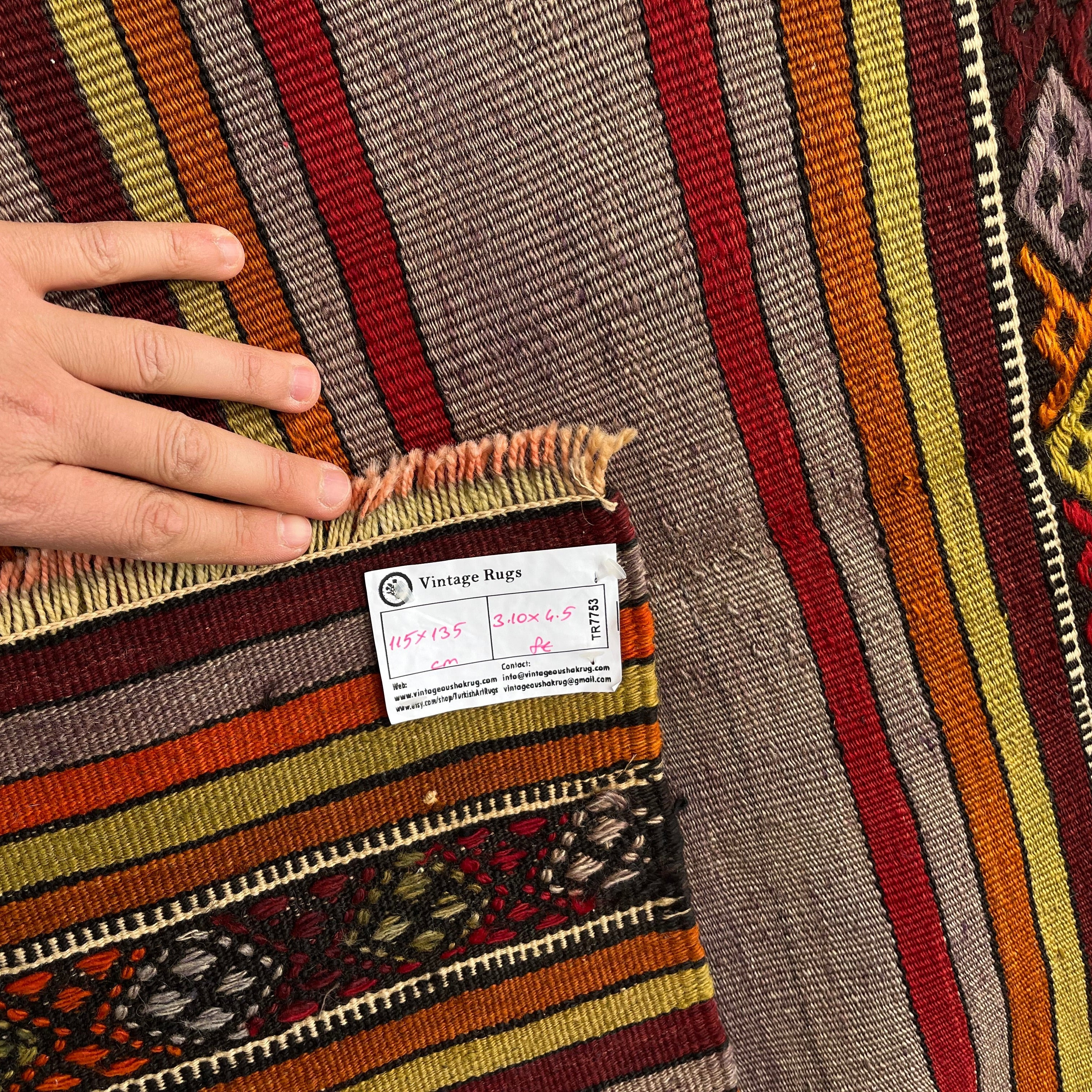 1970s red vintage Turkish kilim rug with striped design, flatweave construction and low pile.