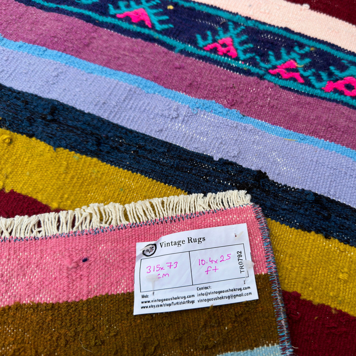 Close-up of the blue vintage Turkish kilim runner rug showing striped details, flatweave construction, wool and cotton and low pile.