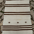 1970s beige vintage Turkish kilim runner rug with striped design, flatweave construction and low pile.