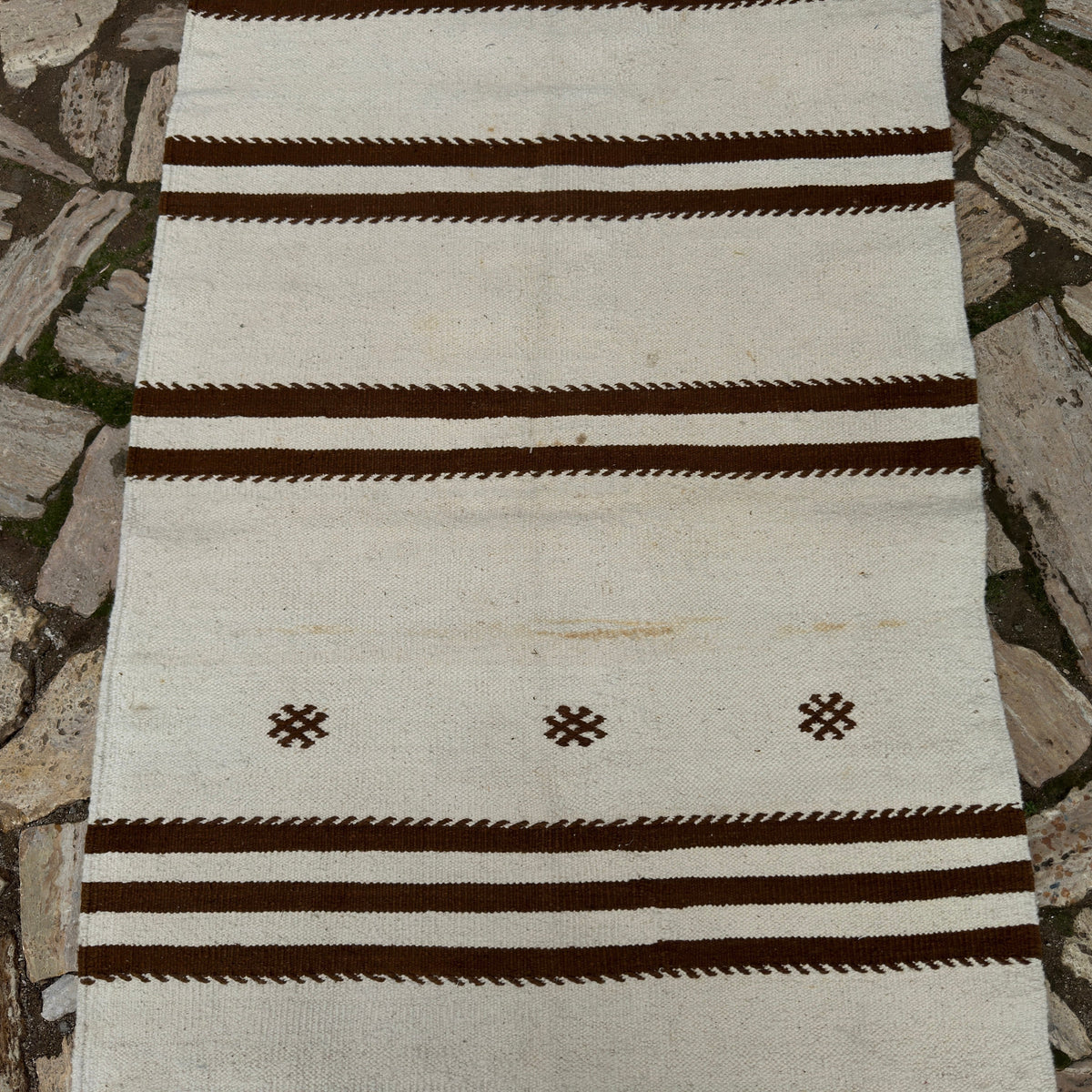 1970s beige vintage Turkish kilim runner rug with striped design, flatweave construction and low pile.