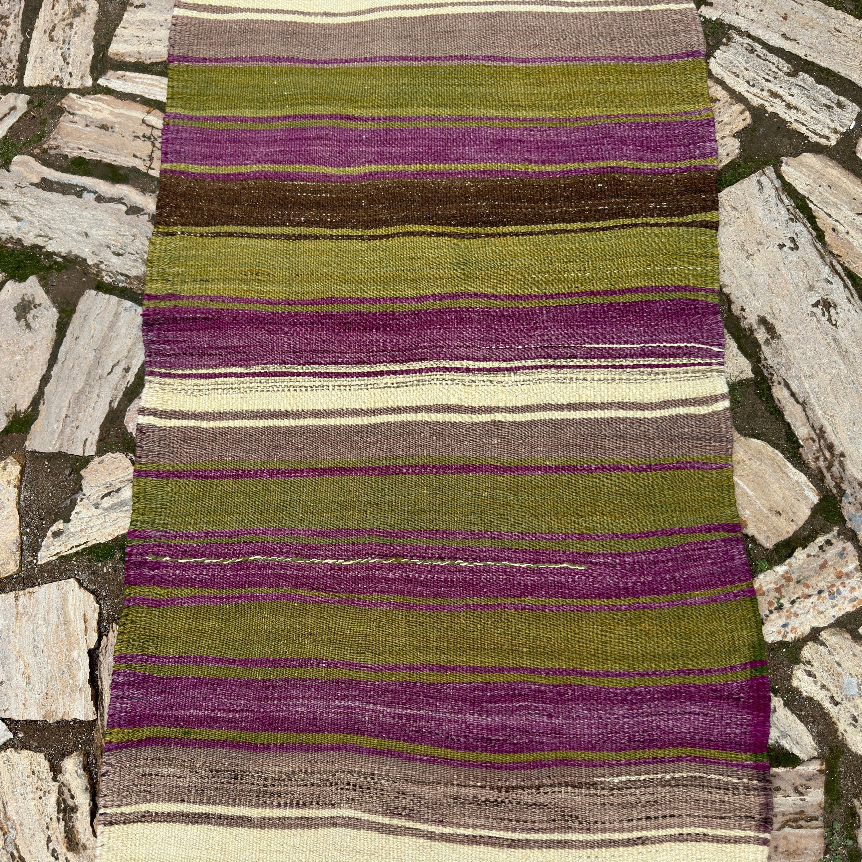 1970s green vintage Turkish kilim runner rug with striped design, flatweave construction and low pile.