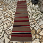 Brown 3' x 12' vintage Turkish kilim runner rug in wool and cotton, shown on the floor.