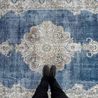 1970s blue vintage Turkish large rug with medallion design, hand-knotted weave and low pile.