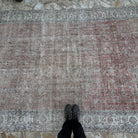 1970s pale red vintage Turkish large rug with floral design, hand-knotted weave and low pile.