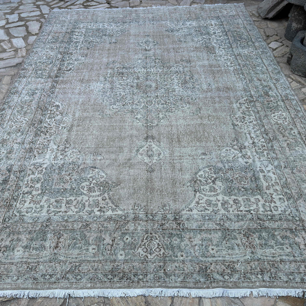 Brown 8' x 12' vintage Turkish large rug in wool and cotton, shown on the floor.