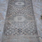 Close-up of the beige vintage Turkish long runner rug showing traditional details, hand-knotted weave, wool and cotton and low pile.