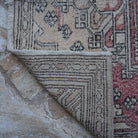 1970s beige vintage Turkish long runner rug with traditional design, hand-knotted weave and low pile.