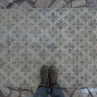 1970s beige vintage Turkish low pile rug with floral design, hand-knotted weave and low pile.